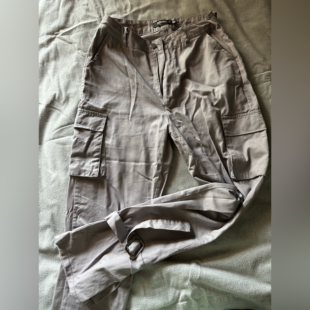 Cargo pants with buckles at ankles
